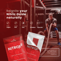 Red packets of Nitrox3 with a gym background and text about nitric oxide.

